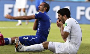 Italy's Giorgio Chiellini claiming he was bitten by Uruguay's Luis Suarez, right, in Natal